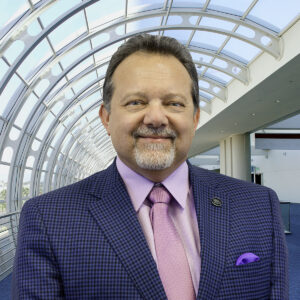 portrait of Rip Rippetoe in front of San Diego Convention Center windows