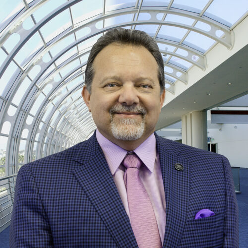 portrait of Rip Rippetoe in front of San Diego Convention Center windows